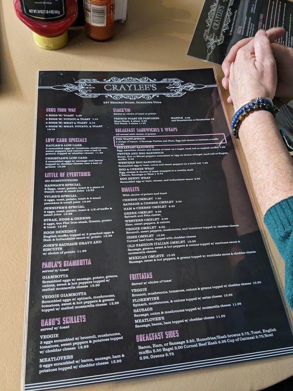 Menu board for eggs, toast, and lunch items.
